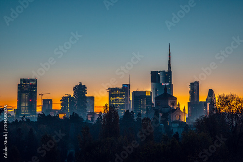 Milan Italy, City skyline at sunset, featuring modern skyscrapers and historic church, perfect for urban and architectural photography. High quality commercial ima
