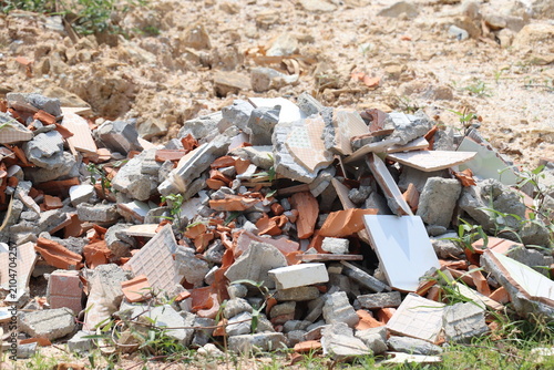 Obraz na płótnie Large pile of broken bricks, concrete, and rubble from building demolition and r