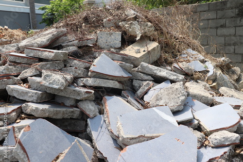 Fotografie Mixed concrete rubble stacked outdoors following demolition and site preparation