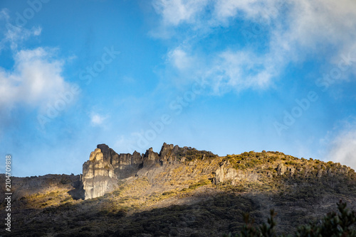 Chirripo, Costa Rica, National Park, Stunning mountain peak with rugged cliffs and clear blue sky. High quality commercial imagery suitable for marketing, advertising, editorial use, and 