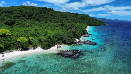 Bild auf Leinwand A tropical landscape featuring a beautiful island with white sandy shores and crystal-clear waters