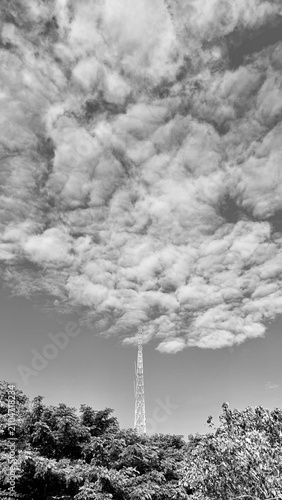 Monochrome Communication Tower Under Dramatic Clouds