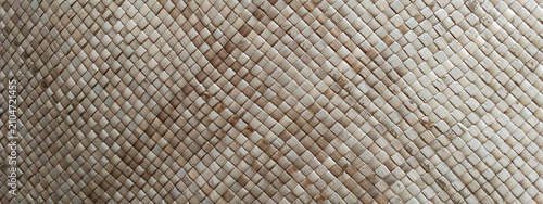 A background featuring the intricate texture of a hand-woven palm leaf mat.