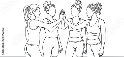 Bild auf Leinwand Group of young women joining hands in a supportive gesture.
