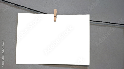 Blank Photo Prints Hanging on Rope with Wooden Clothespins Mockup Template and Copy Space Background