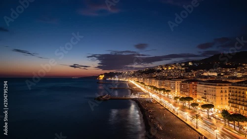 Golden sunset over a coastal city with a scenic beach view