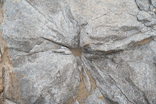 Radial fractured granite texture with dramatic natural rock pattern