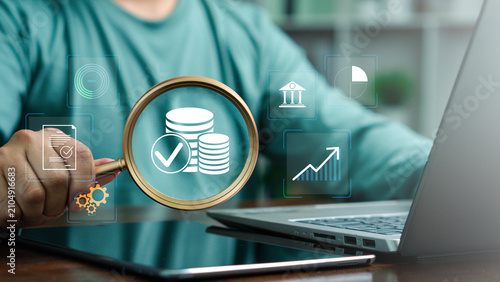 Business professional reviewing a digital financial auditing dashboard with analytics, and performance charts, representing verification, financial analysis, and corporate governance.