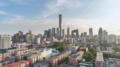 A panoramic view of the old and new city buildings on the sunset skyline of Beijing's CBD, China.