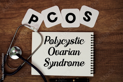 Obraz na płótnie PCOS Polycystic Ovarian Syndrome text written on notepad with stethoscope on woo