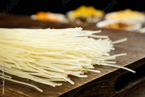Bild auf Leinwand Traditional Handmade Dried Rice Noodles from Jiangxi Province China on Wooden Bo