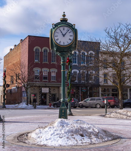 Historic street clock in snowy town square