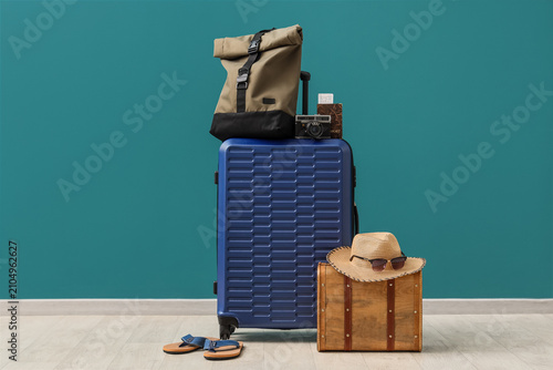 Blue suitcase with travel a...