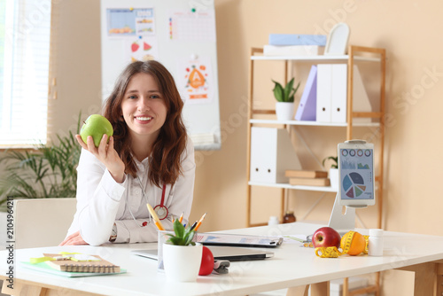 Smiling female nutritionist...
