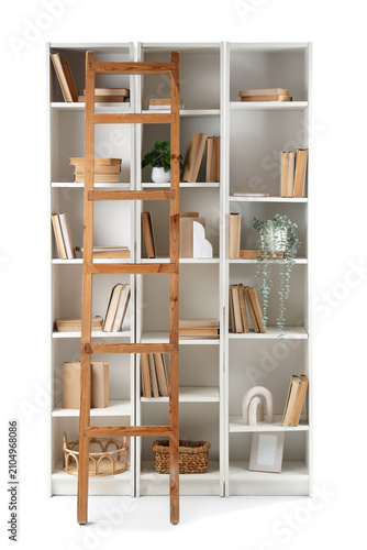 Bookshelf with many books, ...