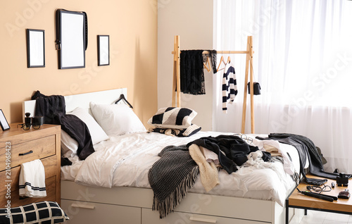 Interior of messy bedroom w...