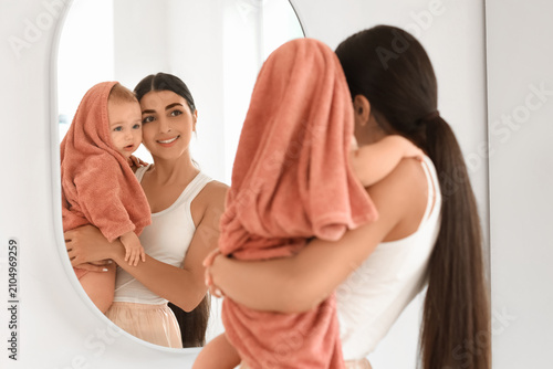 Young mother with her baby ...