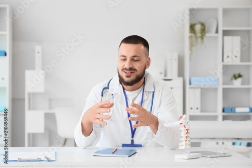 Male doctor giving online c...