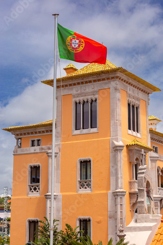 Portuguese flag above historic building in Cascais, Portugal