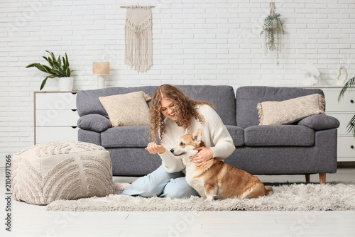 Happy young woman with Corg...