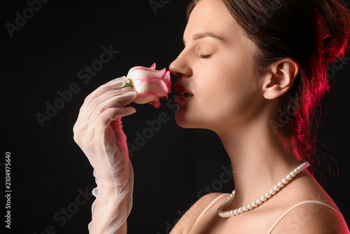 Young woman with rose on da...
