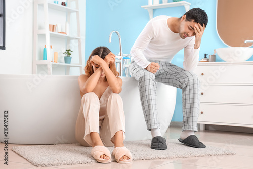 Upset young couple with pre...