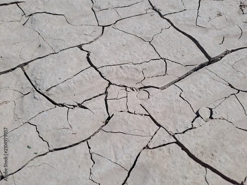 Konstfotografi Dry cracked earth texture from above during drought