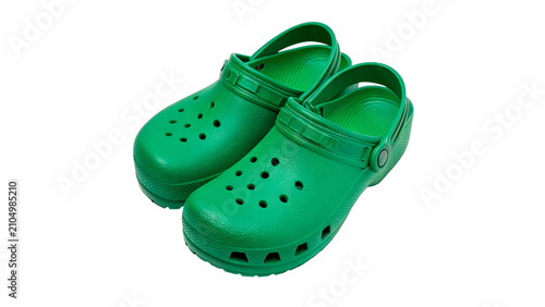 Foto Pair of green plastic lightweight garden clog shoes isolated on transparent back