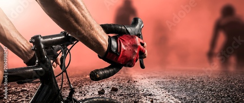 Professional Road Cyclist Gripping Wet Handlebar with Racing Glove During Intense Competition for Cycling Sport Endurance Fitness and Athletic Performance Concepts