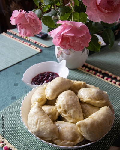 Cherry dumplings and a bouquet of garden roses