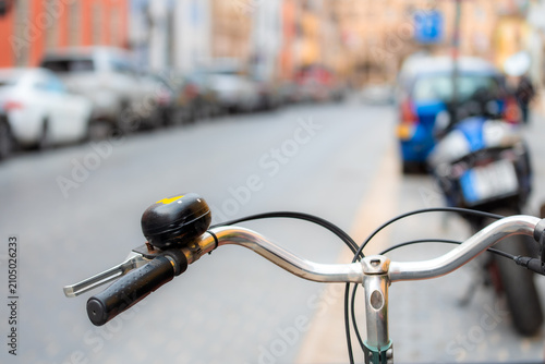 Bicycle Handlebar with Black Bell on an Urban City Street