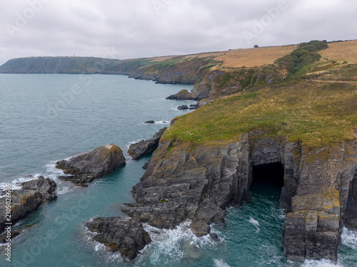 Cuadro en lienzo Aerial views of a rugged coastal landscape with cliffs and turquoise sea in Wale