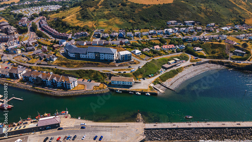 Fotografie Aerial view of harbor bay pier and hillside residential houses