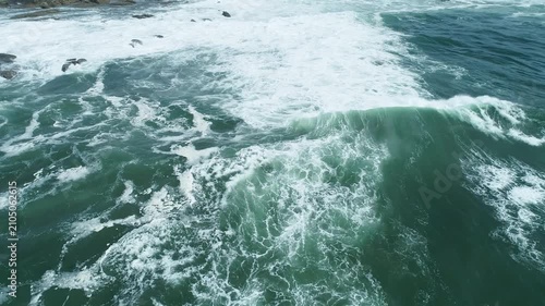 Aerial view of ocean waves crashing into white foam The Concept of raw nature