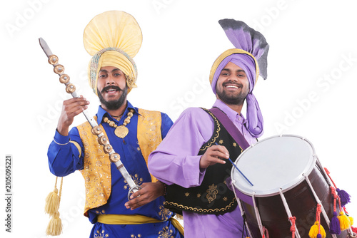 Portrait of Sikh men doing bhangra dance