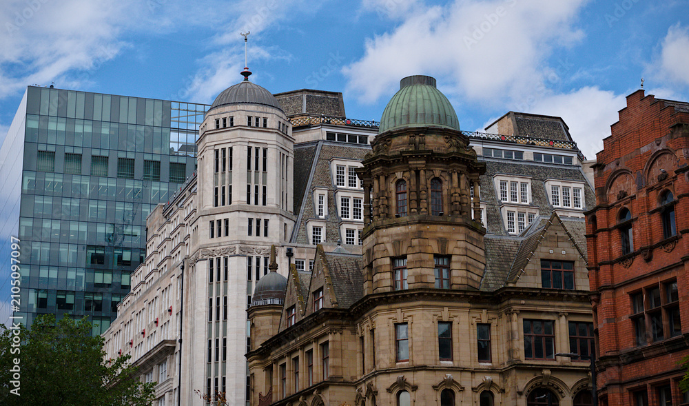 Fototapeta premium Manchester historic architecture with vintage stone dome and modern glass skyscraper facade, classic and contemporary city buildings mix