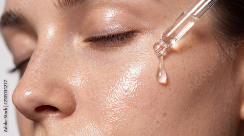 Serum skincare face dropper hydration beauty close up facial skincare routine with serum dropper, glowing hydrated skin