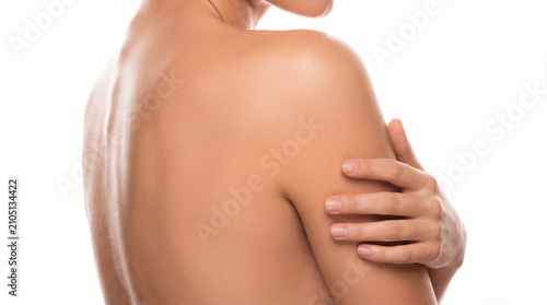 Naked back bare shoulder human skin spa skincare body care nude adult woman hand arm back shoulder beauty wellness hygiene