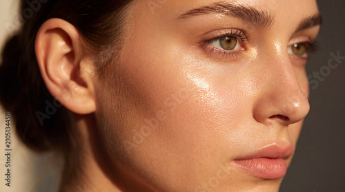 Woman face portrait skincare glowing skin natural makeup Closeup female face portrait with glowing skin, natural makeup