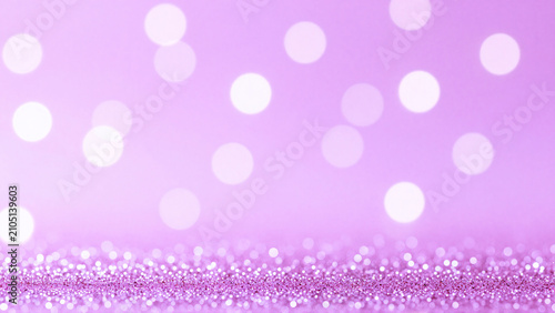 Abstract purple glitter background with soft bokeh lights for festive holiday celebrations