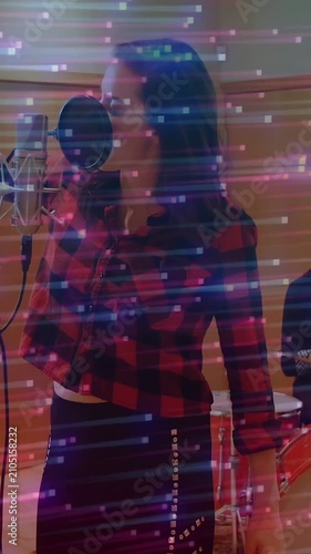 Vertical video: Vocalist at mic, music cue starting singing with pink glitch streaks over vocalist