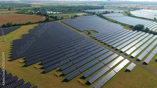 Aerial view of huge solar panel plant for renewable and sustainable energy generation in rural England