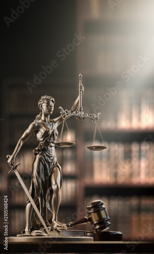 Legal Concept: Themis is the goddess of justice and the judge's gavel hammer as a symbol of law and order on the background of books