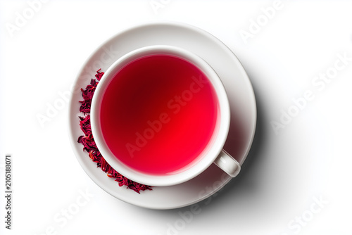 White porcelain cup with ruby red hibiscus tea isolated background