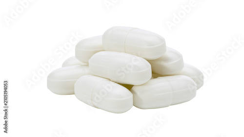 Fotografie Pile of white oval pills with dividing line