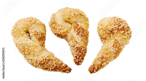 Konstfotografi Golden puff pastry twists coated in coarse sugar