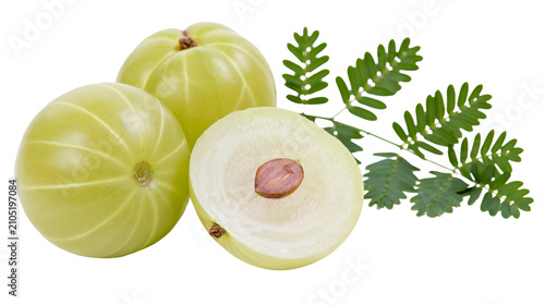 Fotografi Indian Gooseberry fruits with leaves, one cut in half showing seed