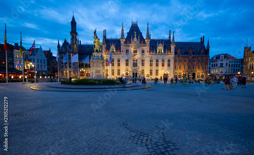 BRUGES, BELGIUM, JULY 14, 2025 - The Provinciaal Hof (Provincial Palace) by night located in the famous market square, the Markt, in the heart of Bruges, Belgium
