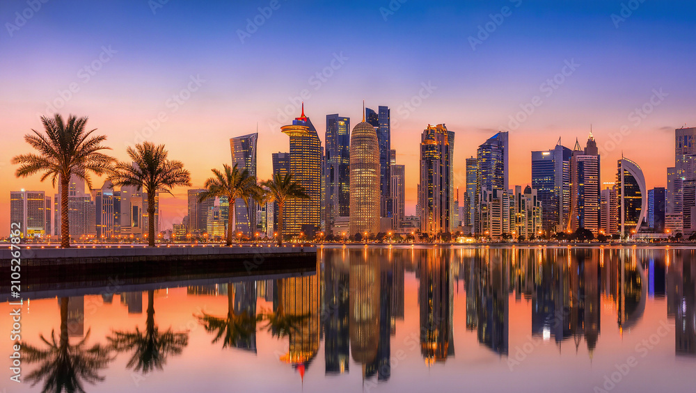 Fototapeta premium Doha Skyline at Sunset with Palm Trees Reflection