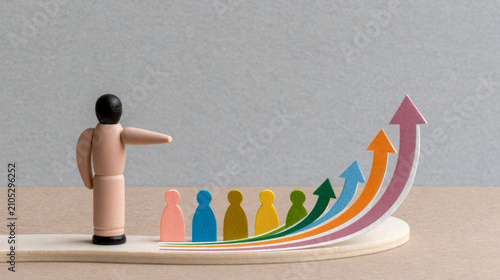 Project management roles are illustrated by wooden figure leading team with colorful arrows symbolizing development and growth in business environment
